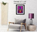 colorful chakra art print with a fuchsia angel torso with the seven chakra colors aligned down the center, and blue lights in her hands and a Reiki symbol over her head and displayed in a white mat with a black frame over a chair