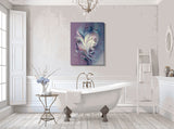 Earthy plums, blue, and creamy swirls surround a dreamy feminine face in the goddess series of stretched canvas visionary art by Primal Painter hanging in a white bathroom