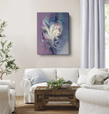 Earthy plums, blue, and creamy swirls surround a dreamy feminine face in the goddess series of stretched canvas visionary art by Primal Painter. hanging in a white living room