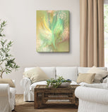 Energy art canvas print by Primal Painter entitled "Higher Self" of an abstract feminine angel with subtle wings in pastel green, yellow, and peach pastel colors in a beige living room