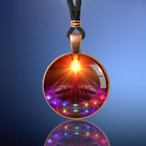 chakra art copper finished necklace with abstract chakra artwork under glass with an orange starburst at the top of the art