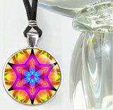 Pink and orange mandala art silver finished round necklace featuring a six pointed fuchsia star with a interlocking blue stars in the center 