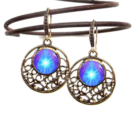 round bronze lacy filligree earrings featuring blue and purple starburst art print sealed under glass