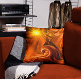 orange throw pillow featuring second chakra artwork by Primal Painter of an angel riding a spiraling wave with a yellow sun in the corner