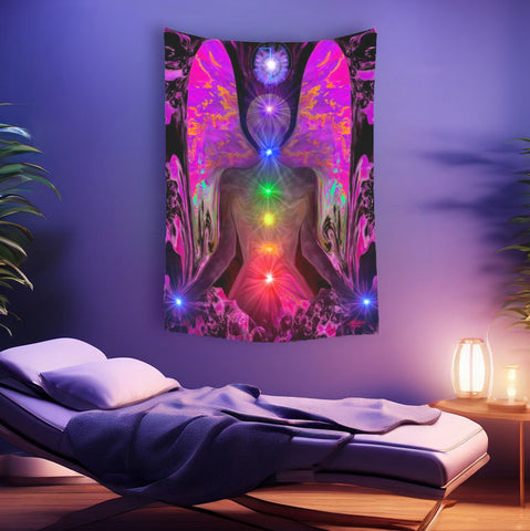 Large wall tapestry of a fuchsia angel with seven chakras through the center of her body hanging above a massage table