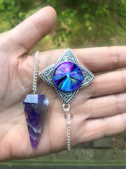 amethyst crystal pendulum featuring a pendant with purple angel art by Primal Painter