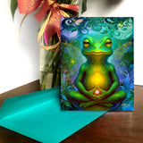 Whimsical greeting card with a colorful illustration of  a frog in the lotus pose, chakras glowing, swirling fantasy background by Primal Painter