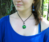 Green twin flames necklace on a model