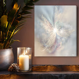 Subtle peach, gray, and plum abstract art canvas print called The Angelic Realm by Primal Painter, hanging over a shelf with a candle