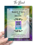 Back of a Card with 'Rainbows of Love with Aphrodite' text and a QR code, held by a hand against a colorful background.