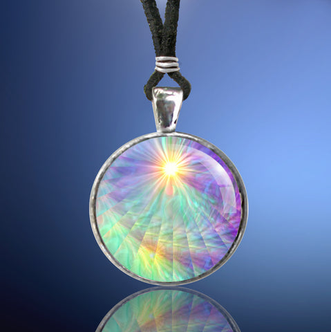 round necklace with a rainbow swirl art print that has rays and a yellow starburst at the top, sealed under a glass dome