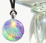 round necklace with a rainbow swirl art print that has rays and a yellow starburst at the top, sealed under a glass dome