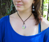 Pastel rainbow swirl wearable art necklace displayed on a model