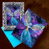 Framed mini art of a rainbow fairy with butterfly wings and a matching greeting card by Primal Painter.