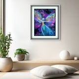 Framed artwork of a fairy with colorful wings on a wall above a wooden shelf with decorative items.