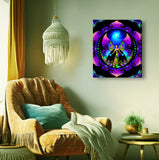 A stretched canvas print featuring a colorful mandala design with a rainbow angel motif, titled 'Breaking Free Mandala' by Primal Painter. Hanging over a comfy chair