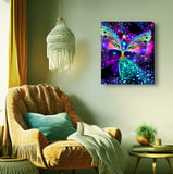 A stretched canvas print called Bubbles of Clearing by Primal Painter featuring a colorful, abstract chakra angel design with a background of multicolored bubbles. Framed above a chair