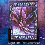 Flower themed abstract art night light (turned off) in  magenta, purple, and violet with  a stained-glass style border. Art by Primal Painter. 
