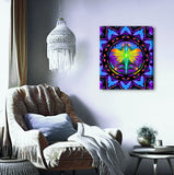 Centered Mandala stretched canvas print by Primal Painter featuring a Rainbow fairy with arms stretched overhead holding lights in her hand inside a circle with an intricate mandala border in multiple rainbow layers. hanging over a cozy chair