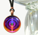 Handmade chakra necklace featuring a metaphysical art print sealed under glass of the seven chakras in a vertical line encircled by wings