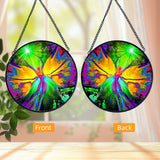 Front and back views: Textured round glass suncatcher featuring rainbow fairy artwork by Primal Painter. 