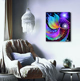 The Divine Path by Primal Painter is a stretched canvas print featuring an angel holding a white orb, huge rainbow wings and dress, blue orbs in one hand, moving up spiraling rainbow steps toward a violet light source. Hanging over a comfy chair