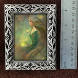 Framed mini goddess print of Elowen of the Woodland Realm by Primal Painter. Earth tones. Next to a ruler