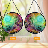 Front and back comparison of a round       glass suncatcher featuring Flower Child art by Primal Painter. 