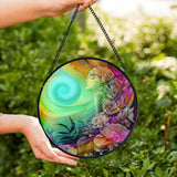 Colorful round glass suncatcher featuring Flower Child by Primal Painter. Rainbow colors and flowers. 
