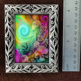 Framed mini print  featuring rainbow goddess art called "Flower Child" by Primal Painter. Displayed next to a ruler