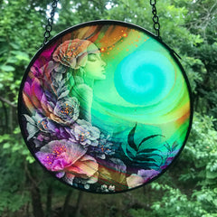 Colorful round glass suncatcher featuring Flower Child by Primal Painter. Rainbow colors and flowers. 