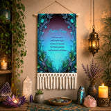 A vertical wall hanging tapestry with a teal and purple ornate border and the printed Reiki Principles in light blue and dark text, displayed on a wall in a styled room with candles, crystals, plants, and a lantern.