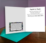 Open card with text and decorative elements on a wooden surface with a purple background
