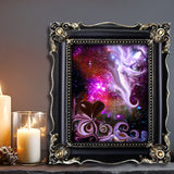 Abstract art print called The Guardian by Primal Painter featuring a stylized, multicolored depiction of a guardian angel with a heart symbol, moons, starts, and a goddess face in the bottom right. Framed on a shelf with candles