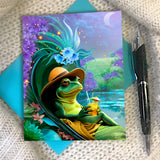 Whimsical greeting card with a frog holding a drink, while lounging on a flowered chair next to  on a textured surface. pond.  Created by Primal Painter. 
