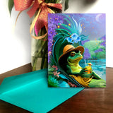 Whimsical greeting card with a frog holding a drink, while lounging on a flowered chair next to a pond.  Created by Primal Painter. 