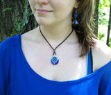 Blue twin flames necklace on a model