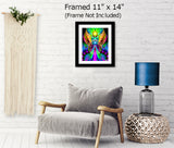 Energy art of two angels with rainbow wings, embracing each other inside a starburst circle. Purples rays of energy are in the background and above is a yellow starburst. Displayed with a mat and frame hanging over a chair