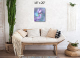 Pastel abstract art canvas print called Inner Vision by Primal Painter featuring a central eye with swirling colors of pink, purple, blue, and gray emanating from the center. Hanging over a couch
