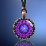 Intuition mandala necklace in a round copper setting. Purple and blue theme.