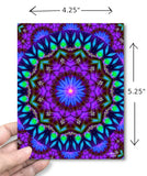 Hand holding a colorful mandala card with measurements indicated