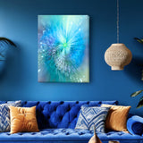 Swirling abstract art canvas print with sparkles in pastel blues, greens, and a touch of lavender called "Intuitive Sparks" by Primal Painter. Displayed on a blue wall above a blue couch.