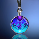 round necklace featuring teal and purple geometric abstract art by Primal Painter of a heart being encircled by angel wings and sealed under glass