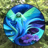 Round glass fairy suncatcher in a black frame and a hanging black chain featuring Lunaria Silvermist of the Fae Realm by Primal Painter. Blues, greens, and purples, and florals. 