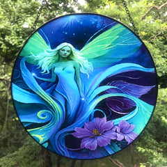 Round glass fairy suncatcher in a black frame and a hanging black chain featuring Lunaria Silvermist of the Fae Realm by Primal Painter. Blues, greens, and purples, and florals. 