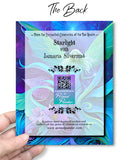 The back of a Greeting card featuring artwork by Primal Painter of an ethereal fairy amidst swirling art nouveau flowers and foliage in greens, purples, and blue. 