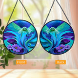 Side by side front and back views of a Round glass fairy suncatcher in a black frame and a hanging black chain featuring Lunaria Silvermist of the Fae Realm by Primal Painter. Blues, greens, and purples, and florals. 