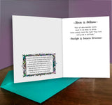 Open card with text and decorative elements on a wooden surface with a purple background