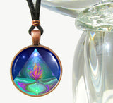 Handmade necklace featuring metaphysical art by Primal Painter of a green pyramid enclosing a violet flame against a blue background