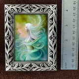 Next to a ruler, Framed mini print featuring Mystrelle of the Elemental Realm by Primal Painter. Air and Water Theme